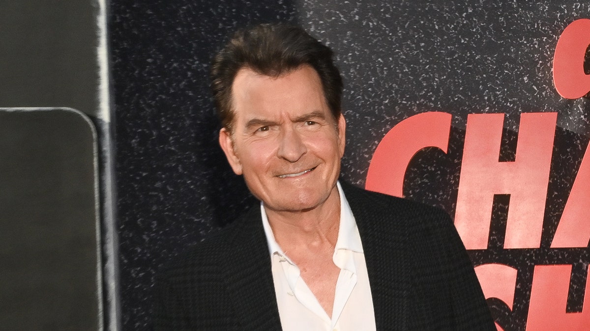 Charlie Sheen wears black suit on Netflix red carpet