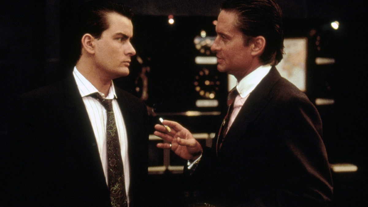 Charlie Sheen acting out a scene from Wall Street with Michael Douglas.