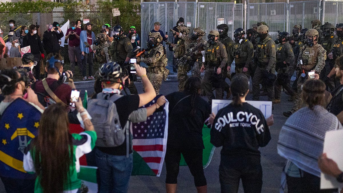 Anti-ICE protesters and authorities in Broadview, Illinois.