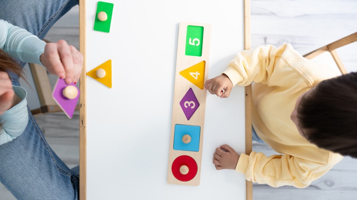 Boy with autism playing games