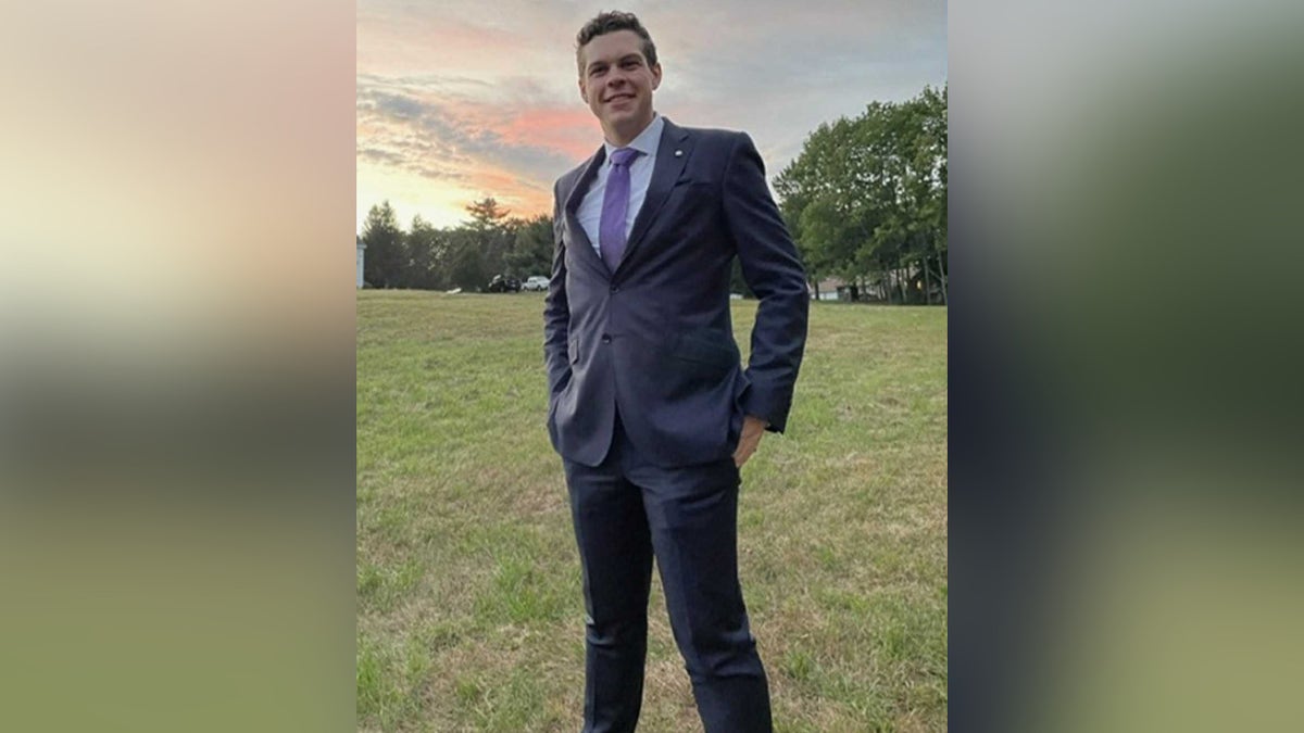 Christopher Perry, a North Carolina man who tragically died before his wedding, seen smiling in a suit at sunset prior to his death.