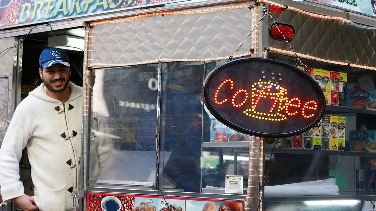 NYC coffee cart vendor smiling