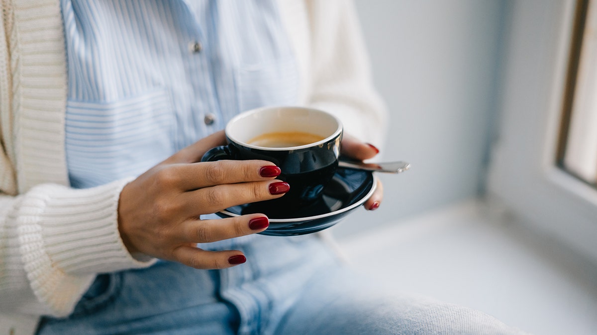 woman with cup of coffee