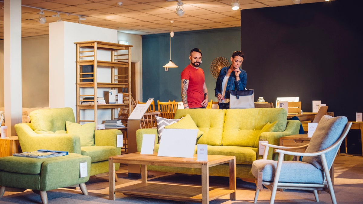 couple shopping for couch