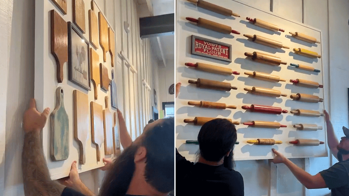 Workers remove the modern décor from the white walls at a Cracker Barrel restaurant.