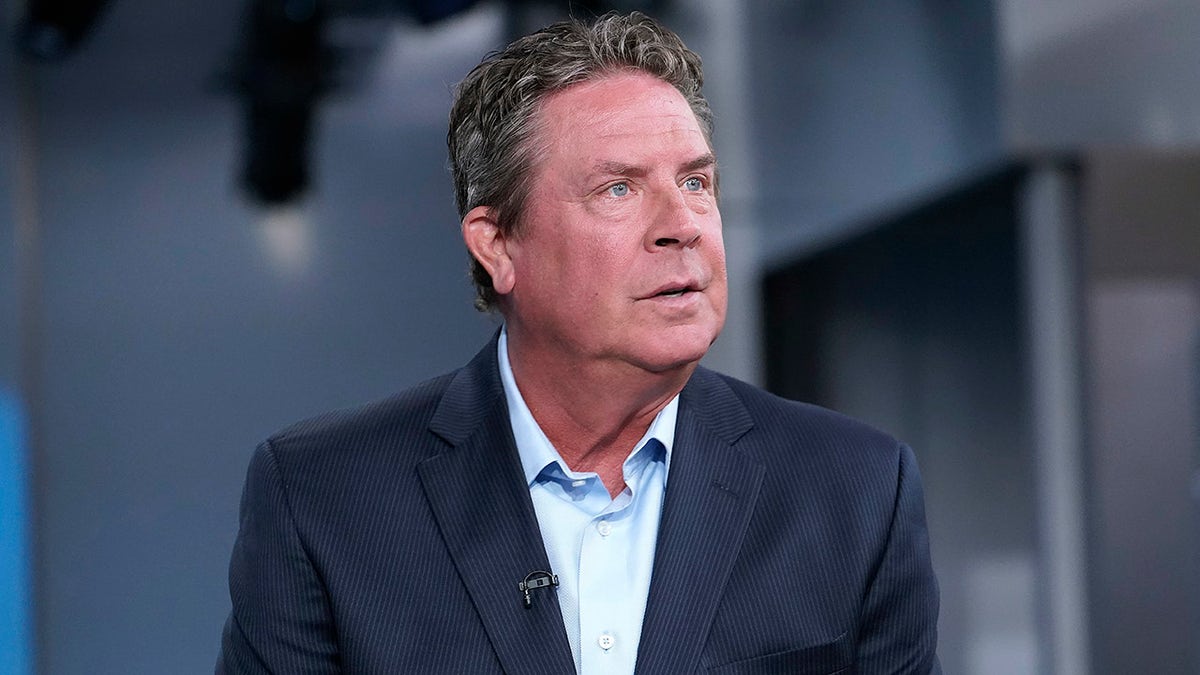 Dan Marino looks on