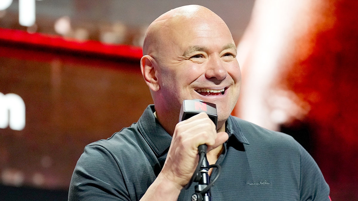 Dana White speaking into a mic 