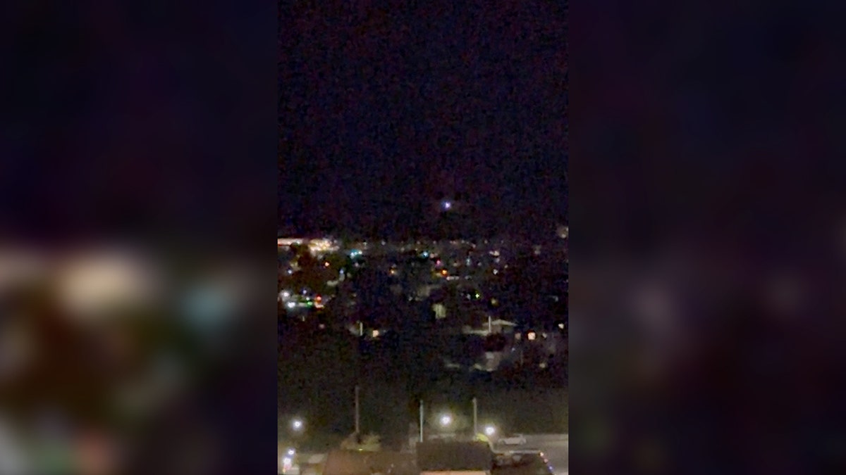 A light moves in the sky over Aalborg, Denmark, on Sept. 24, 2025, amid reports of drone sightings that led to the city's airport being closed.