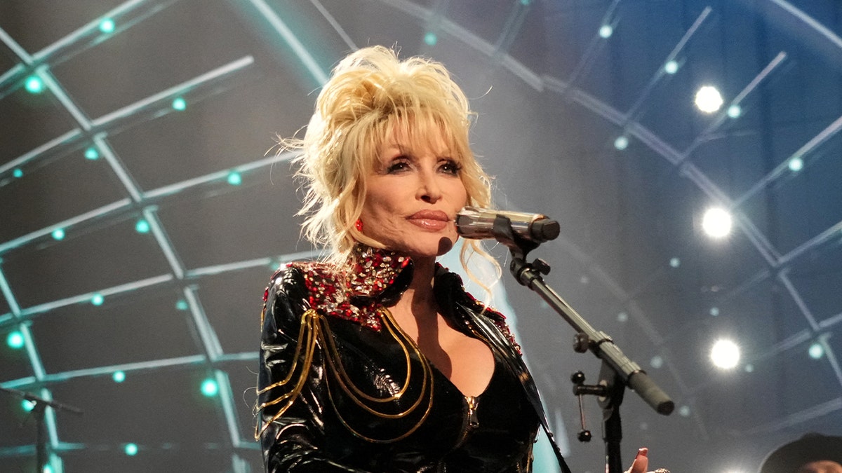 Dolly Parton wears leather jumpsuit on stage