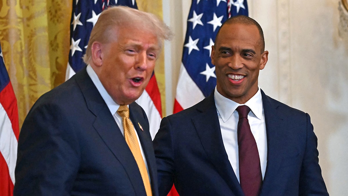 Scott Turner smiling with Donald Trump