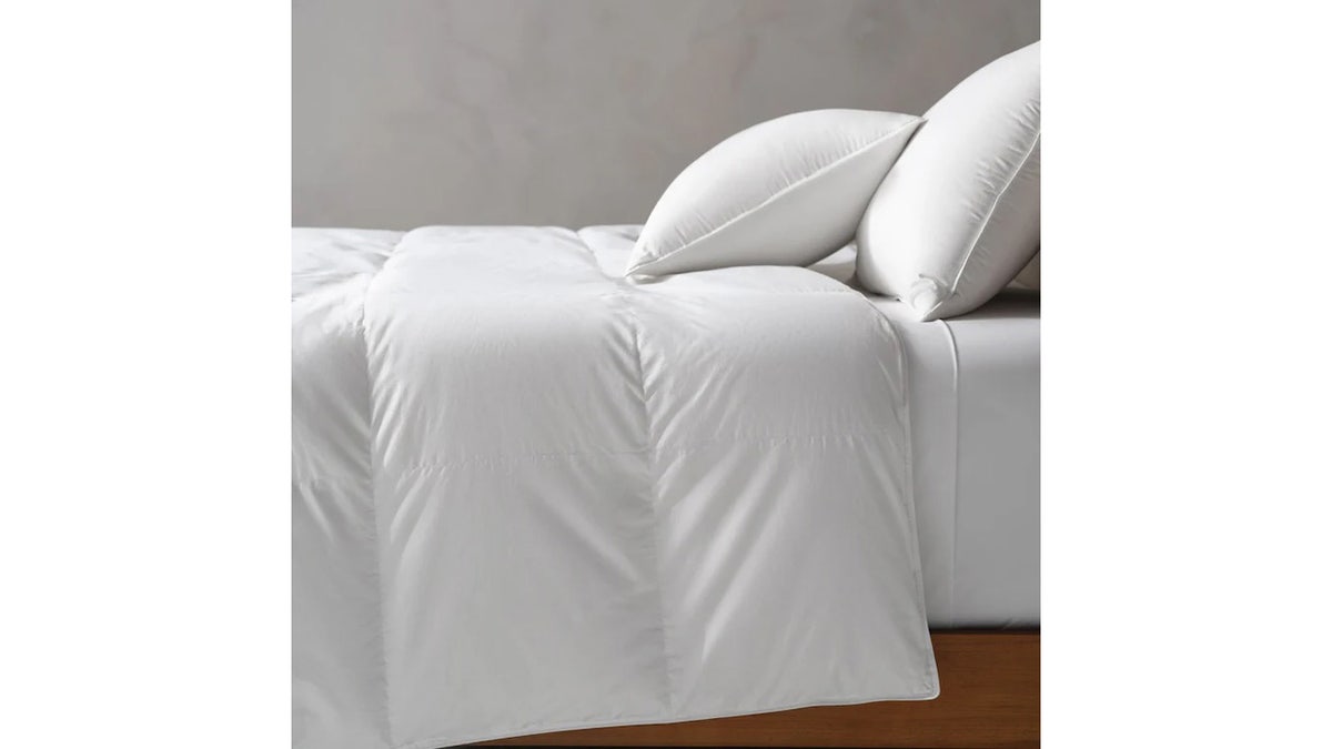 An important bedding layer is a down comforter, which helps trap heat on cool fall days. 