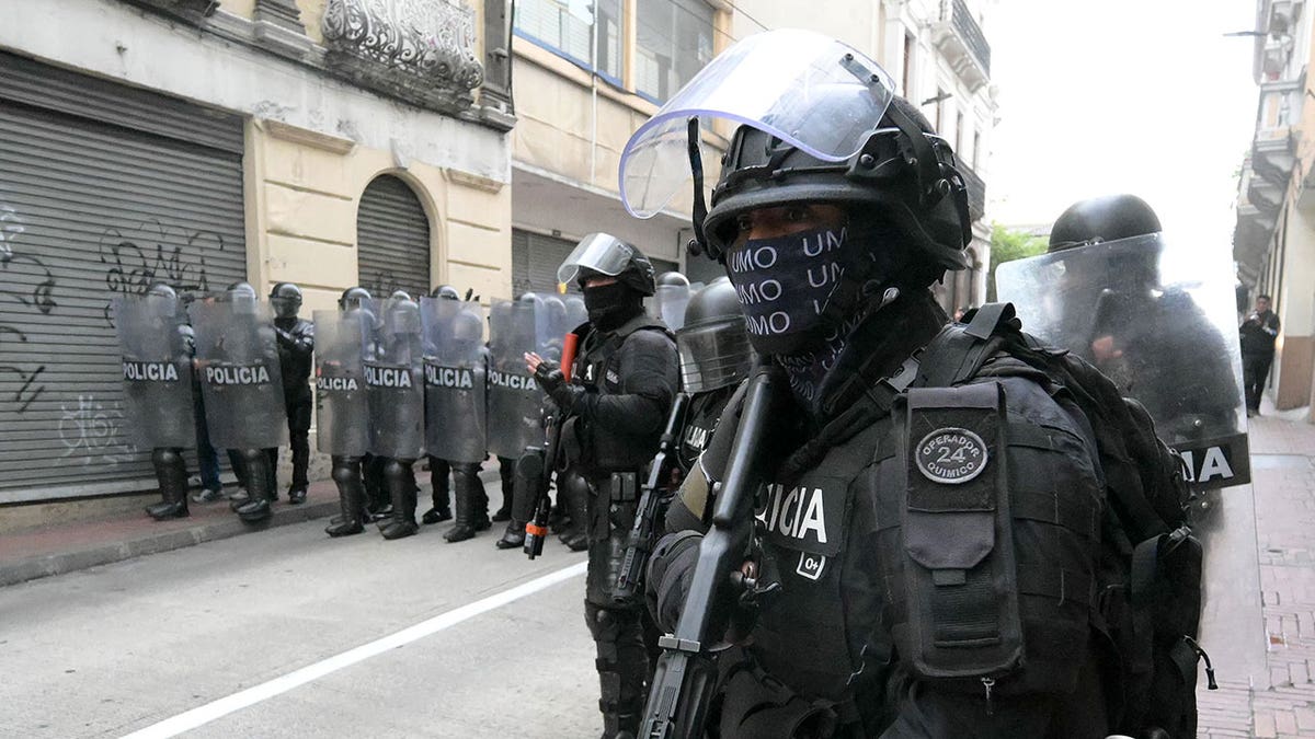 Ecuador police stand off with protestors