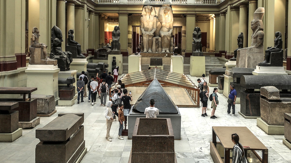 Tourists walking around Egyptian Museum in Cairo