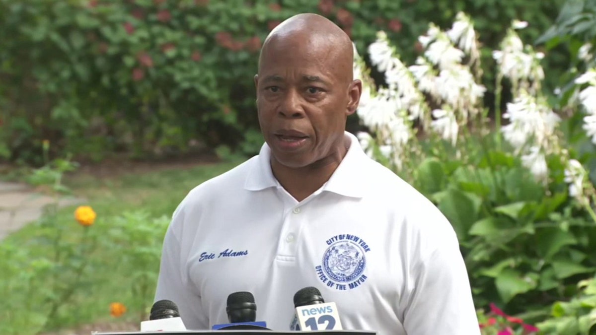 Eric Adams speaks to reporters at a press conference