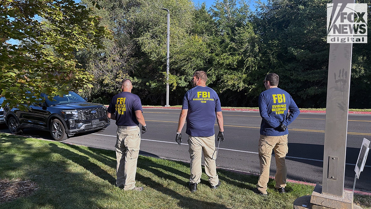 FBI agents standing by a road
