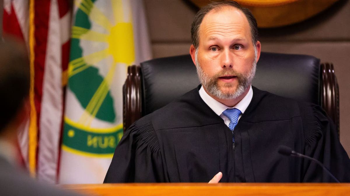 Judge Timothy T. McCourt seated at the bench.