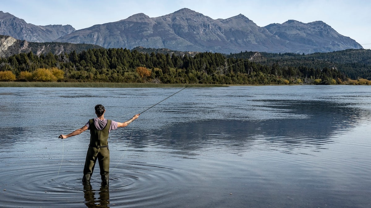 The man flies in water fishing