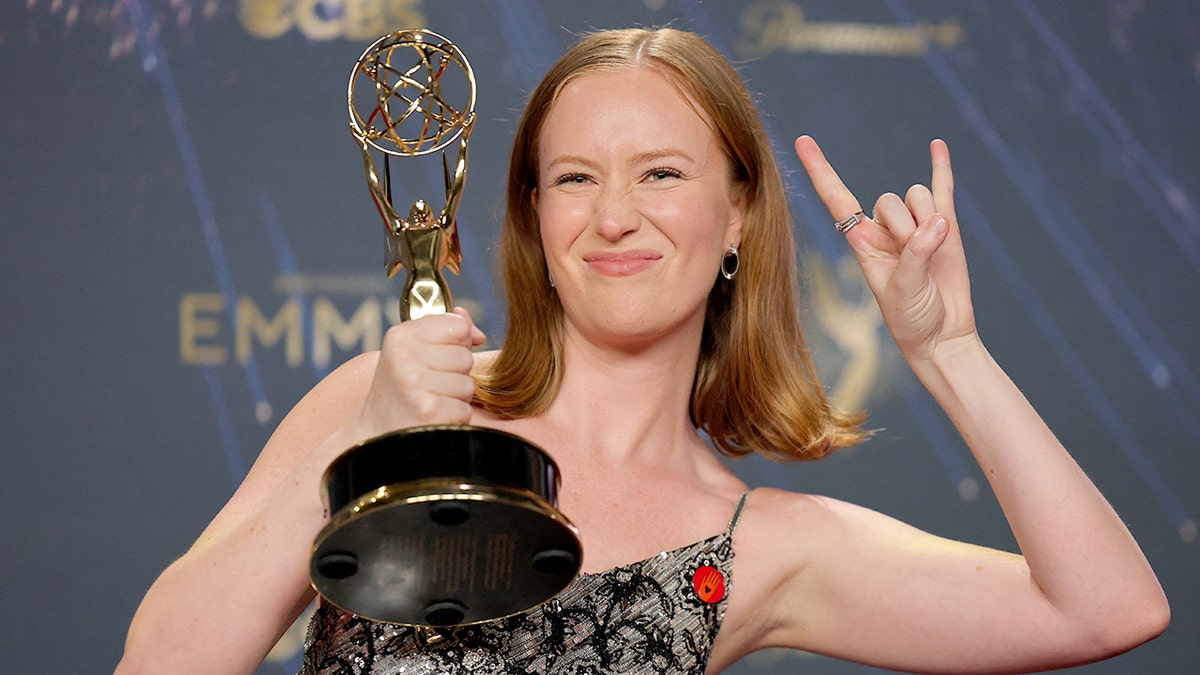 Actress Hannah Einbinder holding her Emmy in 2025