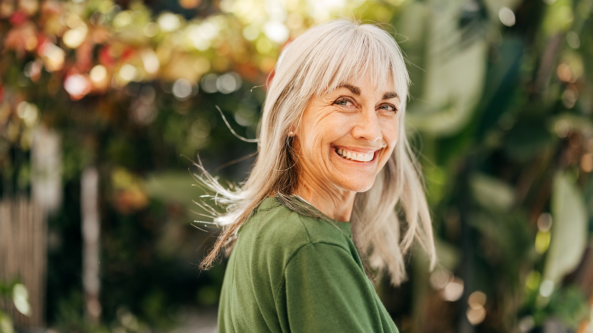 happy senior woman smiles