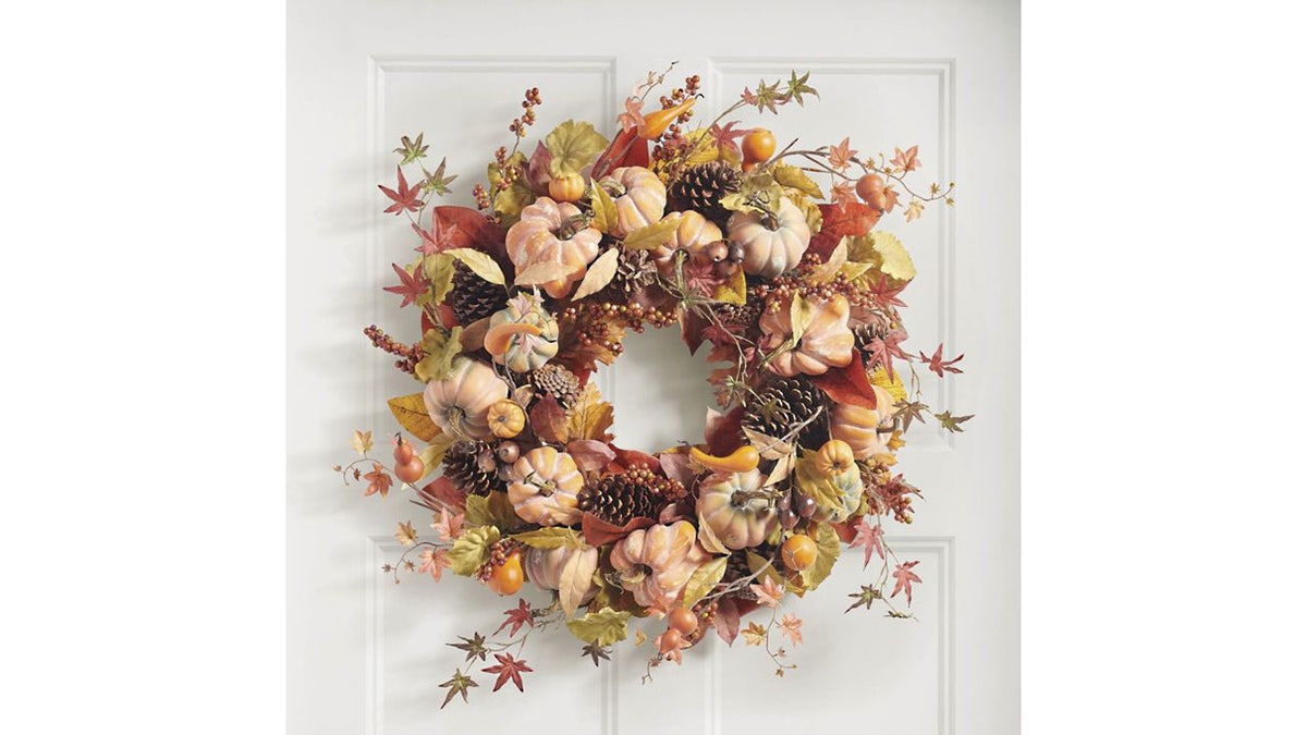This Wreath is full of pinedes, maple leaves, berry collections and teeth.