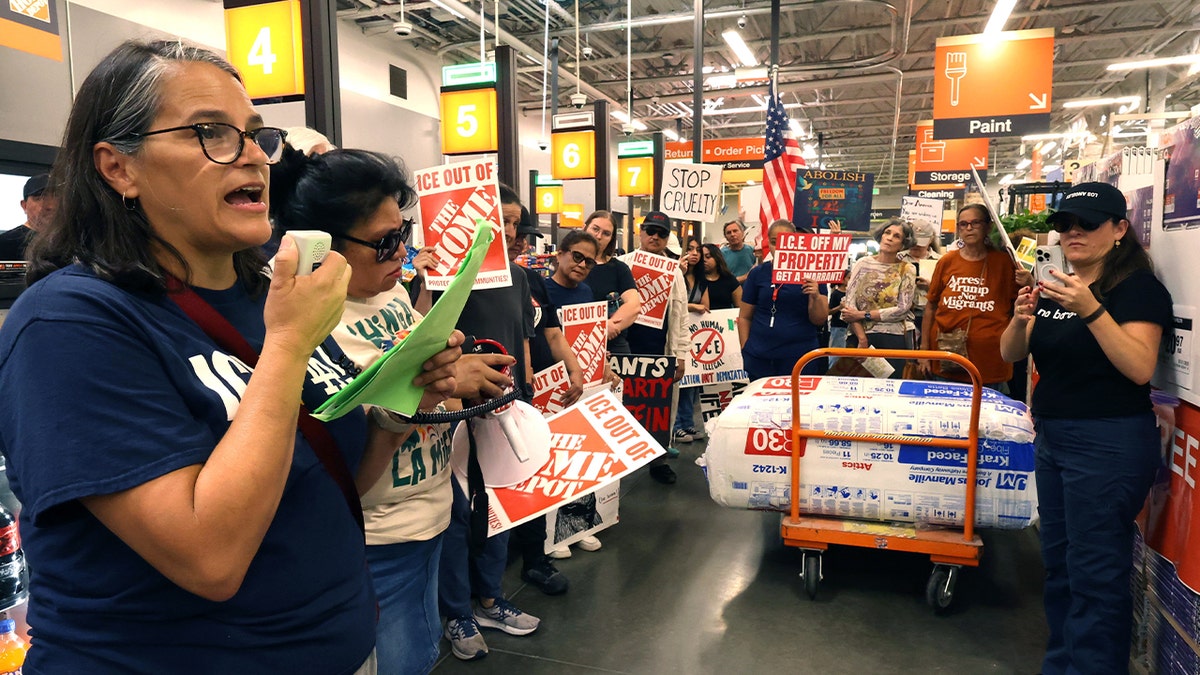 Protesters demonstrate inside of a Home Depot.
