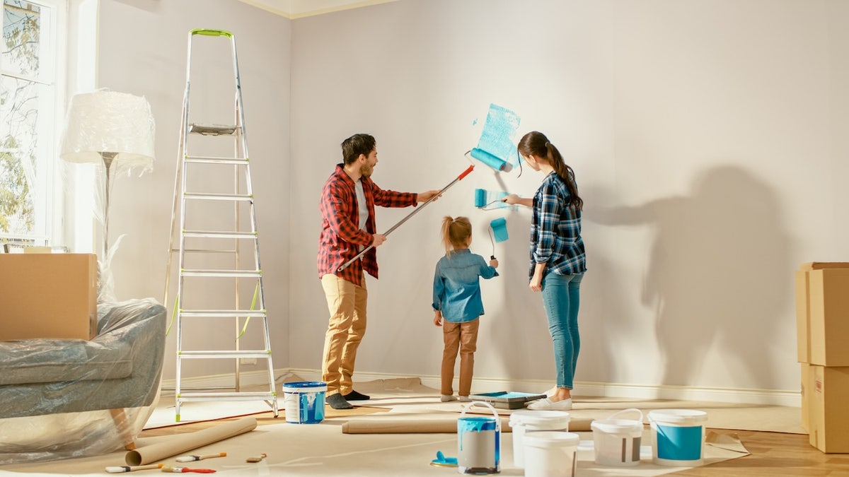 family painting their home