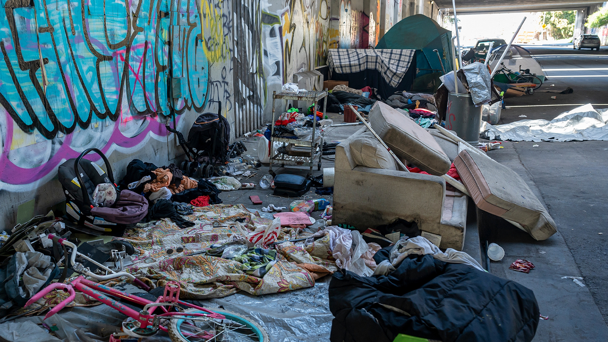 Homeless encampment littering a sidewalk in Oakland