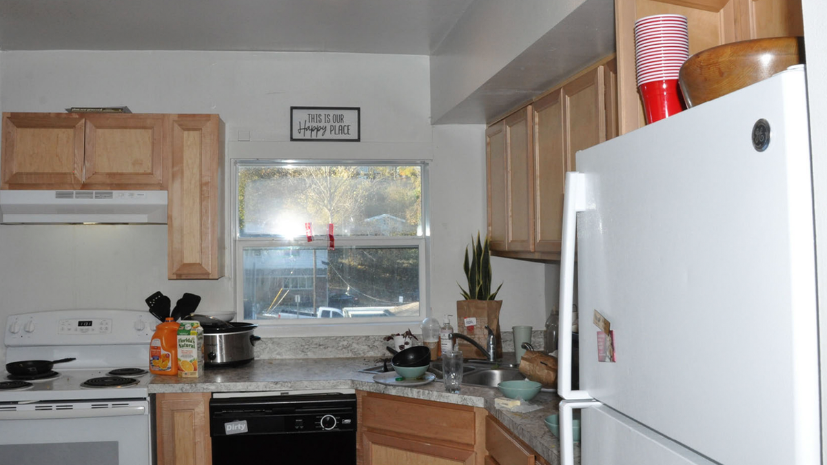 unwashed dishes, juice containers left on the counter and a popped but uneaten bag of popcorn in the King Road kitchen