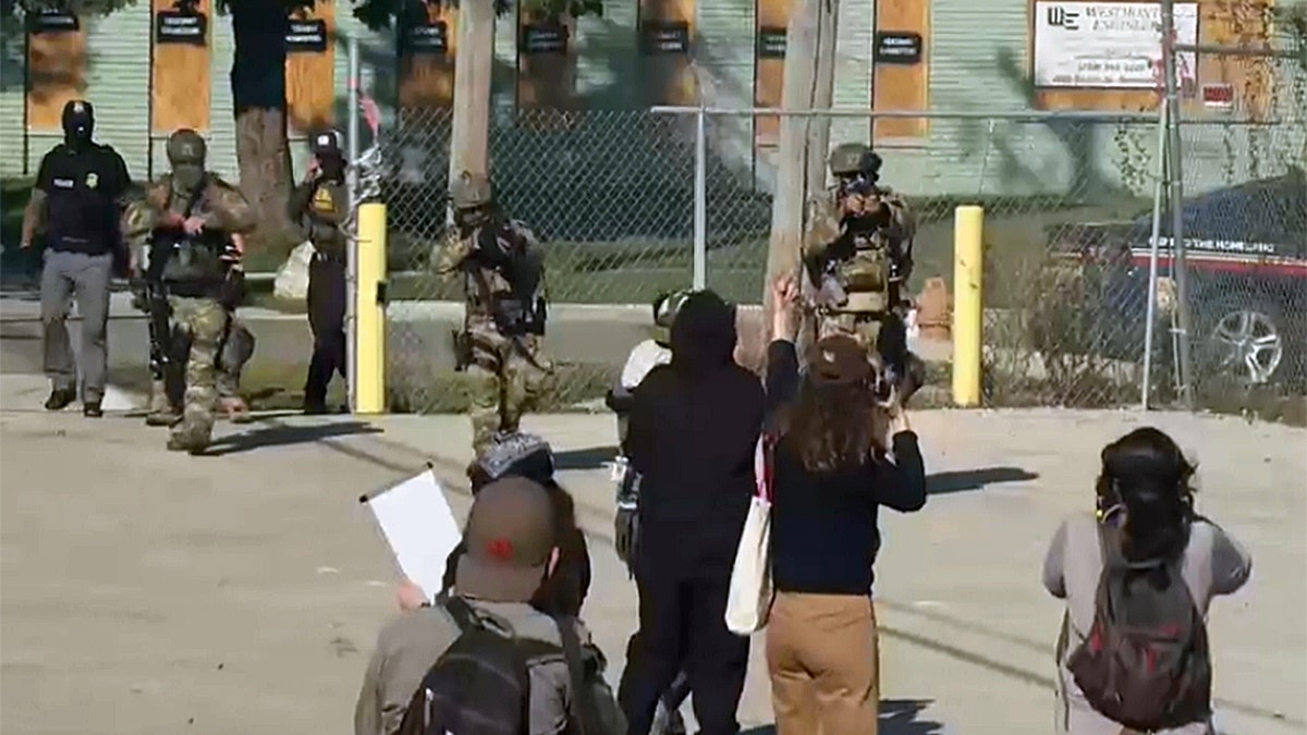 Chicago anti-ICE protesters block vehicles, get hit with tear gas and pepper balls