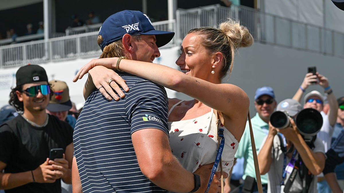 Jake Knapp hugs his girlfriend, Makena White