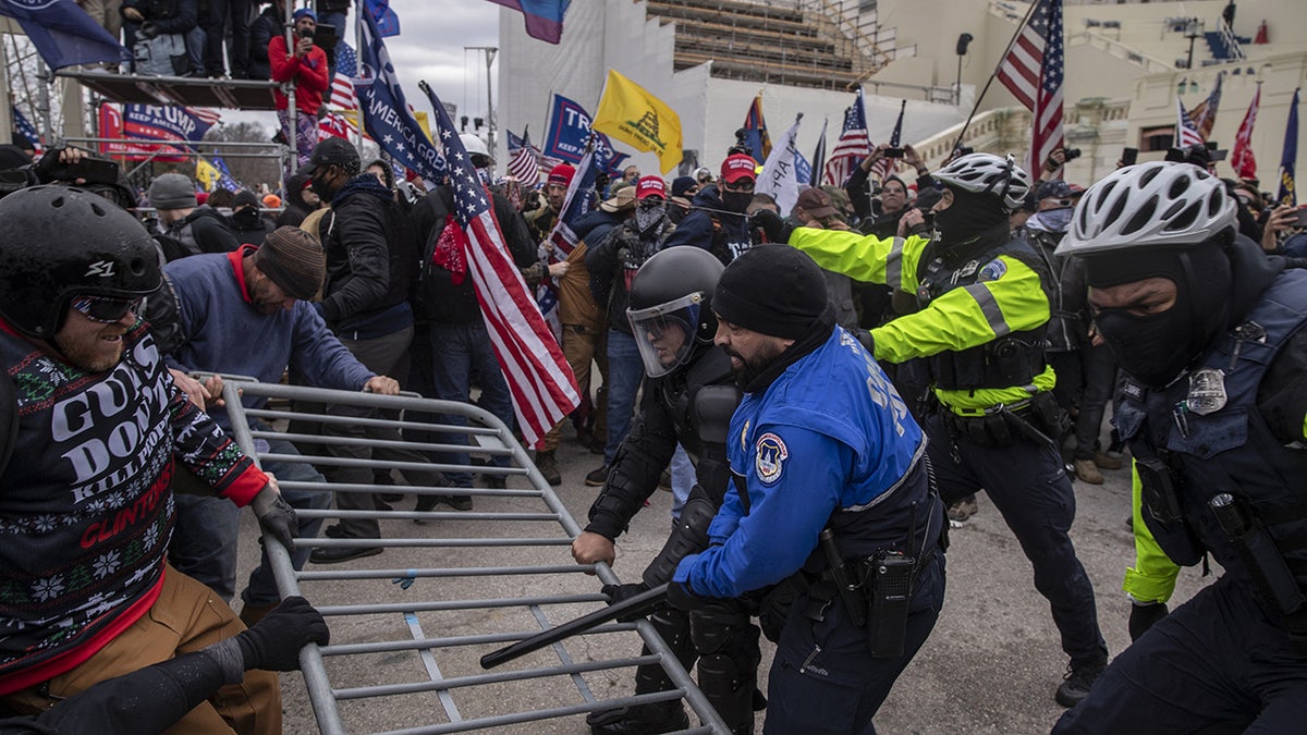 Police pushing back rioters
