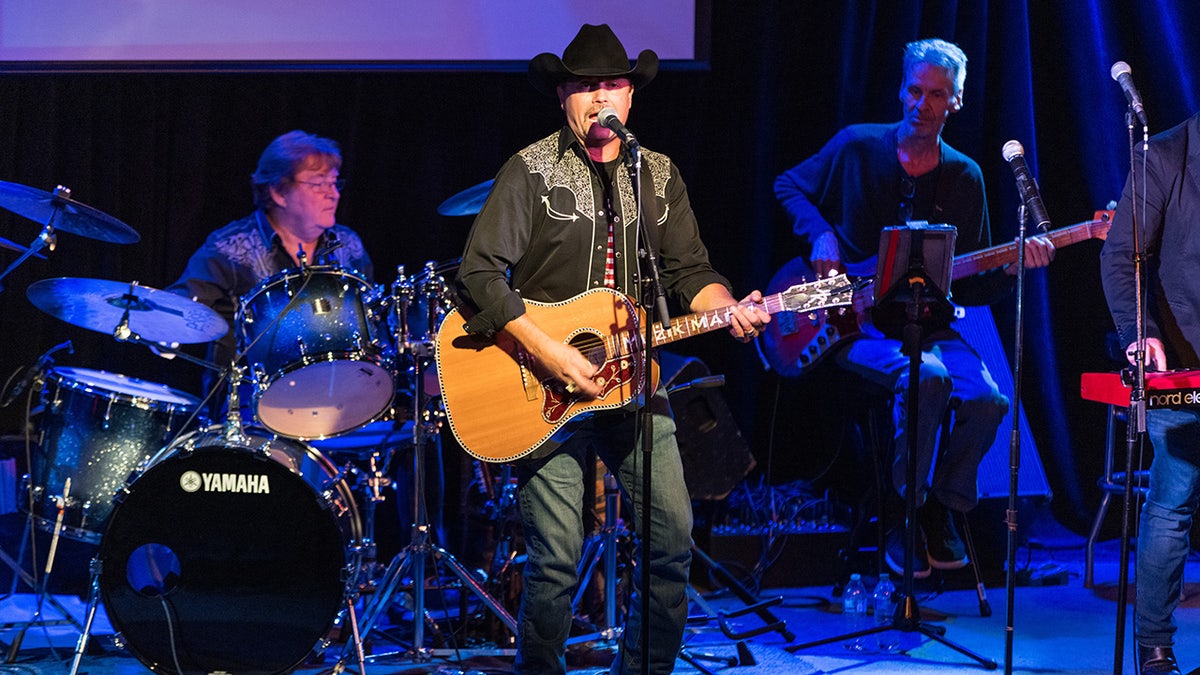 John Rich performing on stage