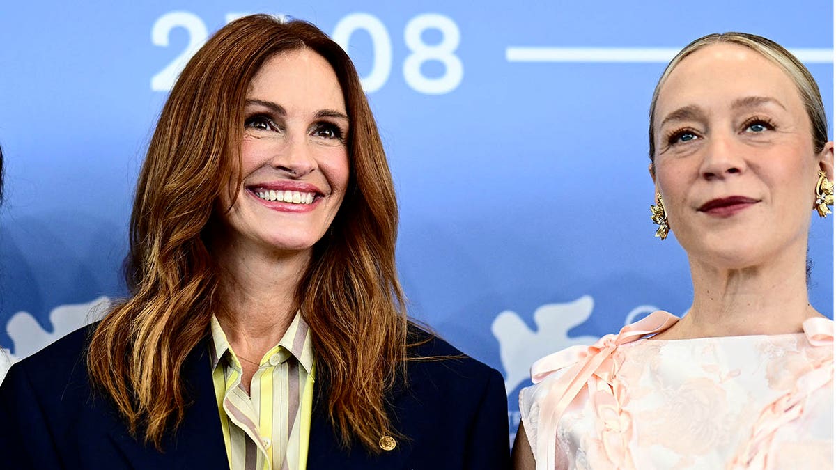Julia Roberts and Chloe Sevigny smile on the red carpet.
