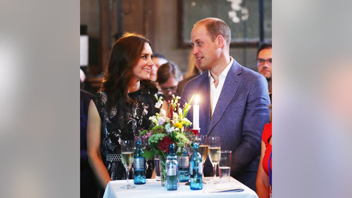Kate Middleton and Prince William admiring each other during a candlelit dinner.