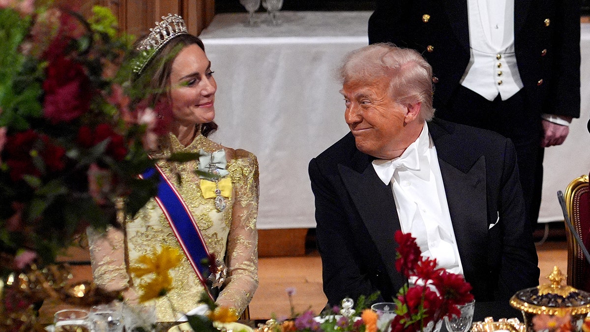 Trump and Kate Middleton smiling at each other at the state banquet.