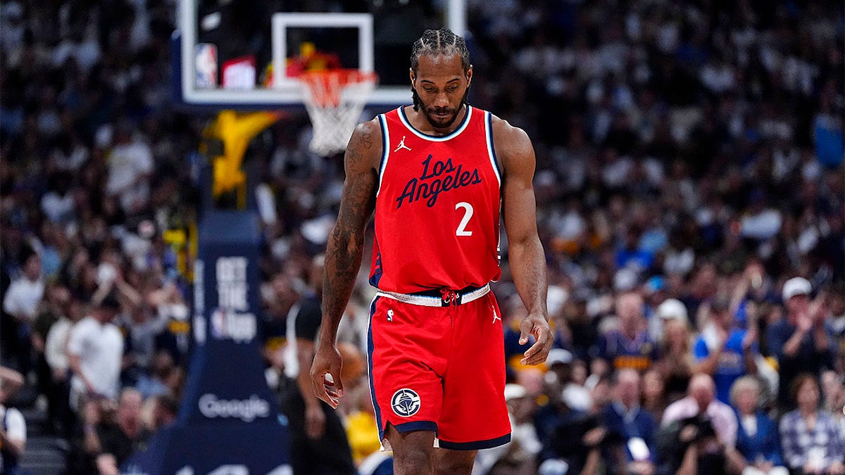 Kawhi Leonard looks down