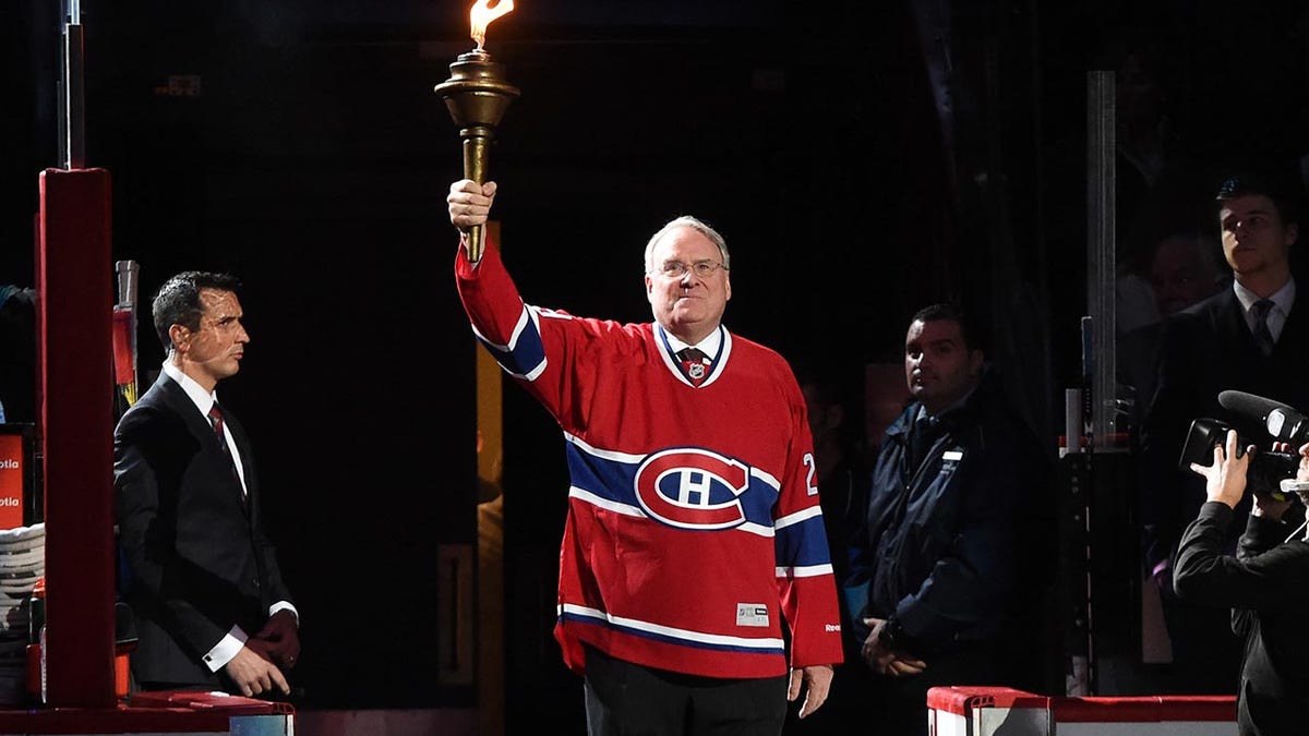 Ken Dryden holding torch