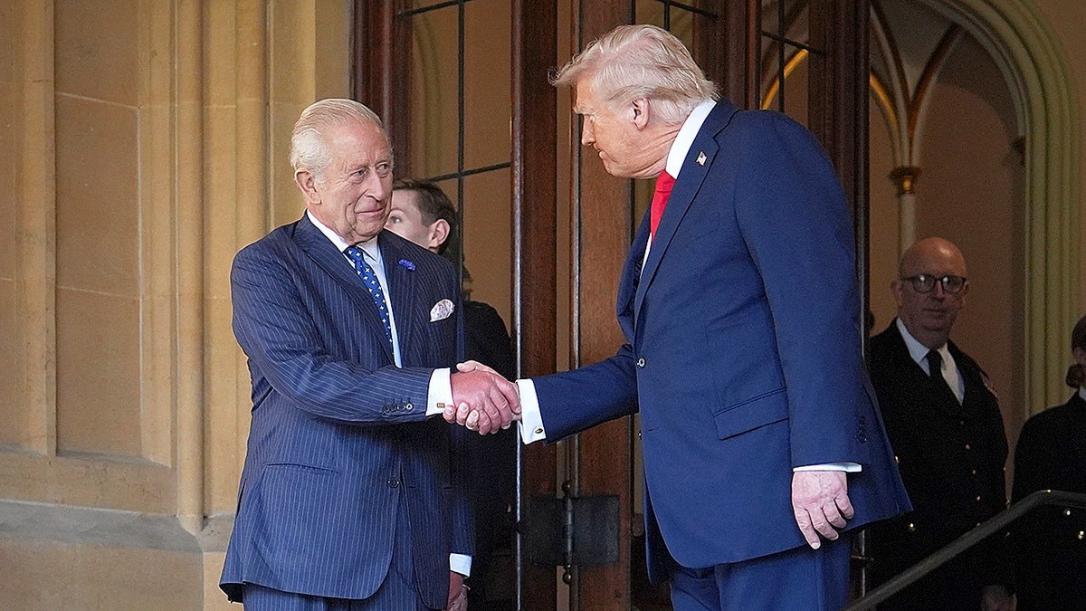 King Charles shaking hands with Donald Trump