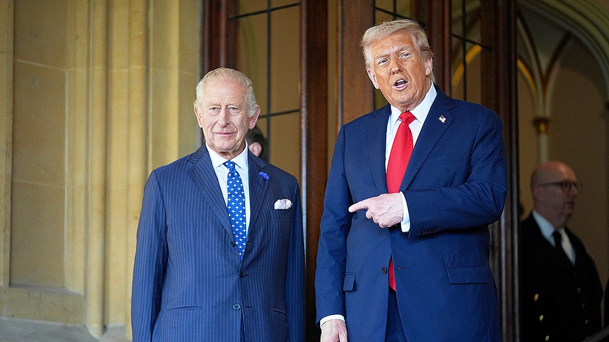 Donald Trump pointing at King Charles