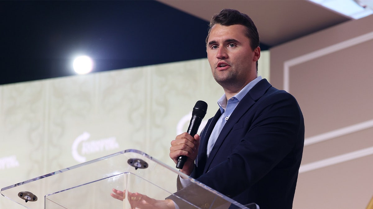 Charlie Kirk speaking at podium