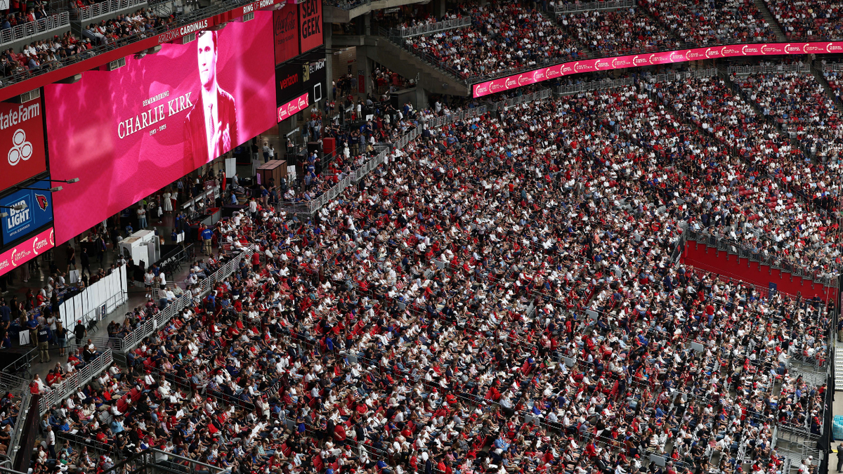 An image of Charlie Kirk and the crowd gathered a the memorial service