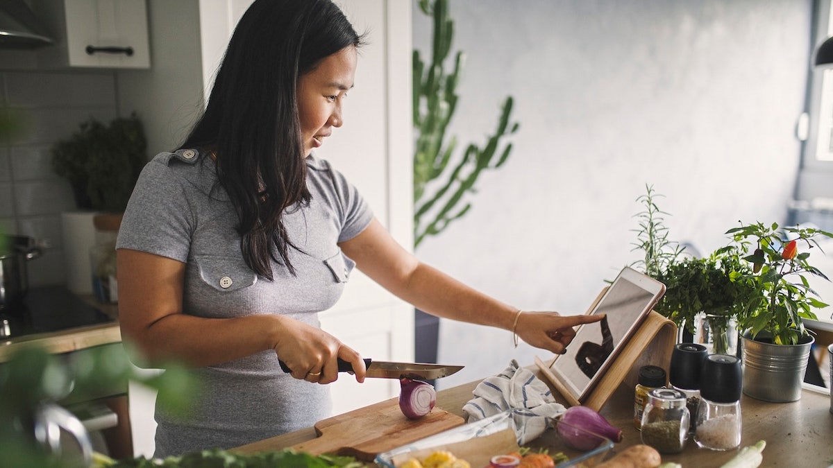 woman cooking in her kitchen