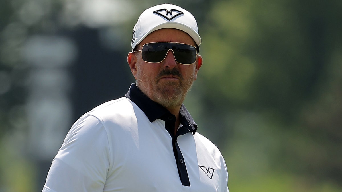 Phil Mickelson looking on from the fourth hole at Bolingbrook Golf Club