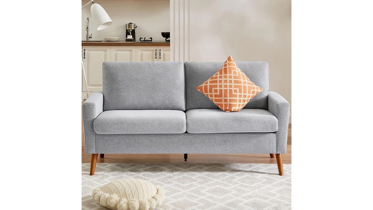 Fit this stylish loveseat easily into a small space.