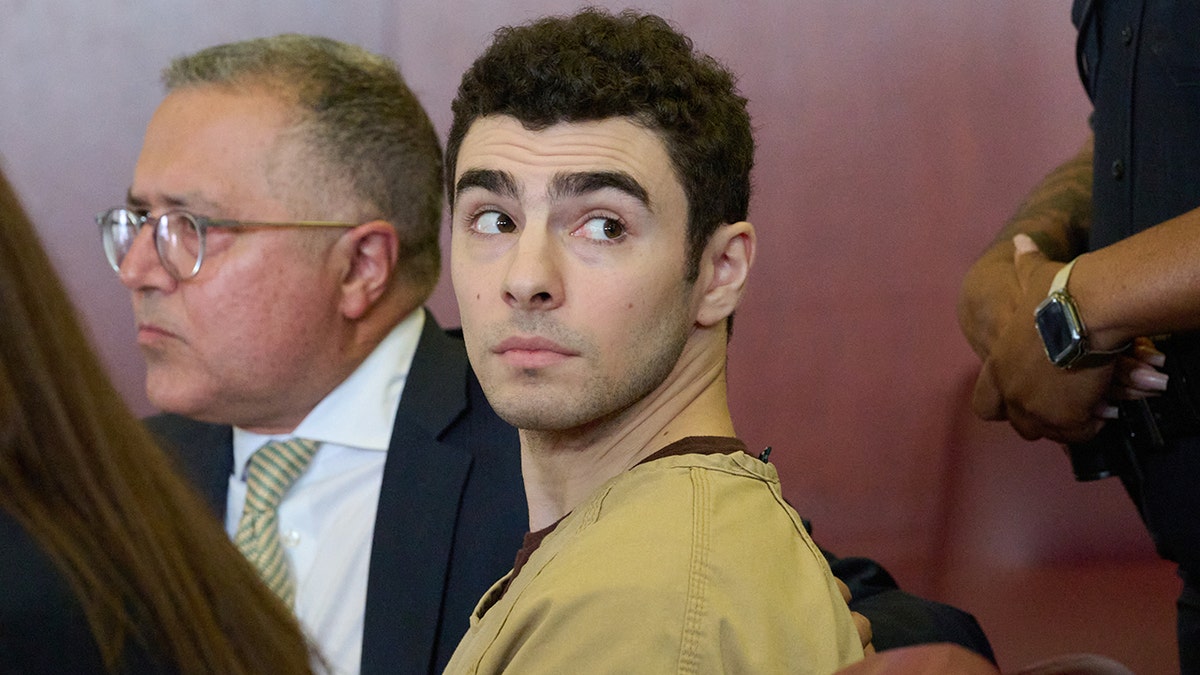 Luigi Mangione sat in court as the judge dropped the terrorism charge.