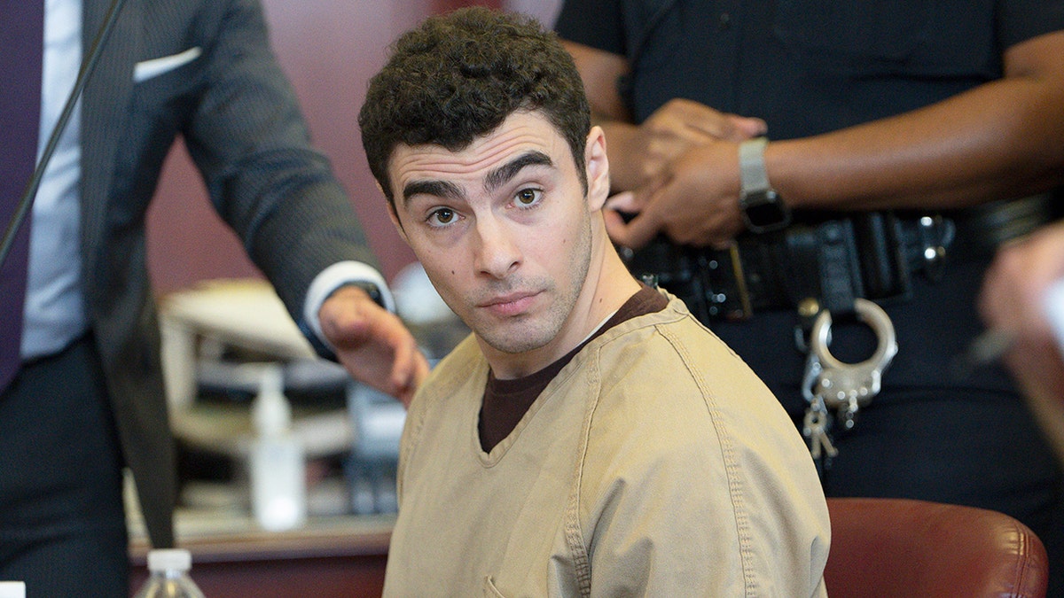 Luigi Mangione sat in court as the judge dropped the terrorism charge.
