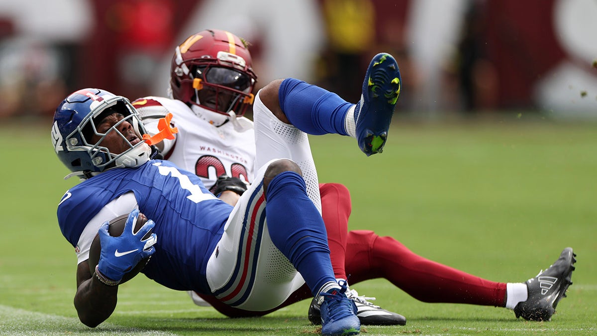 Malik Nabers tackled by Mike Sainristil