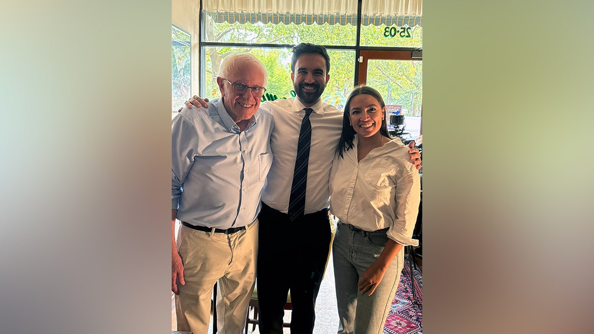 Bernie Sanders, Zohran Mamdani and Alexandria Ocasio-Cortez pose together in Astoria, Queens