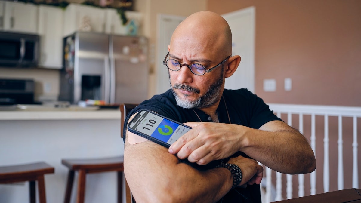 Man testing blood sugar