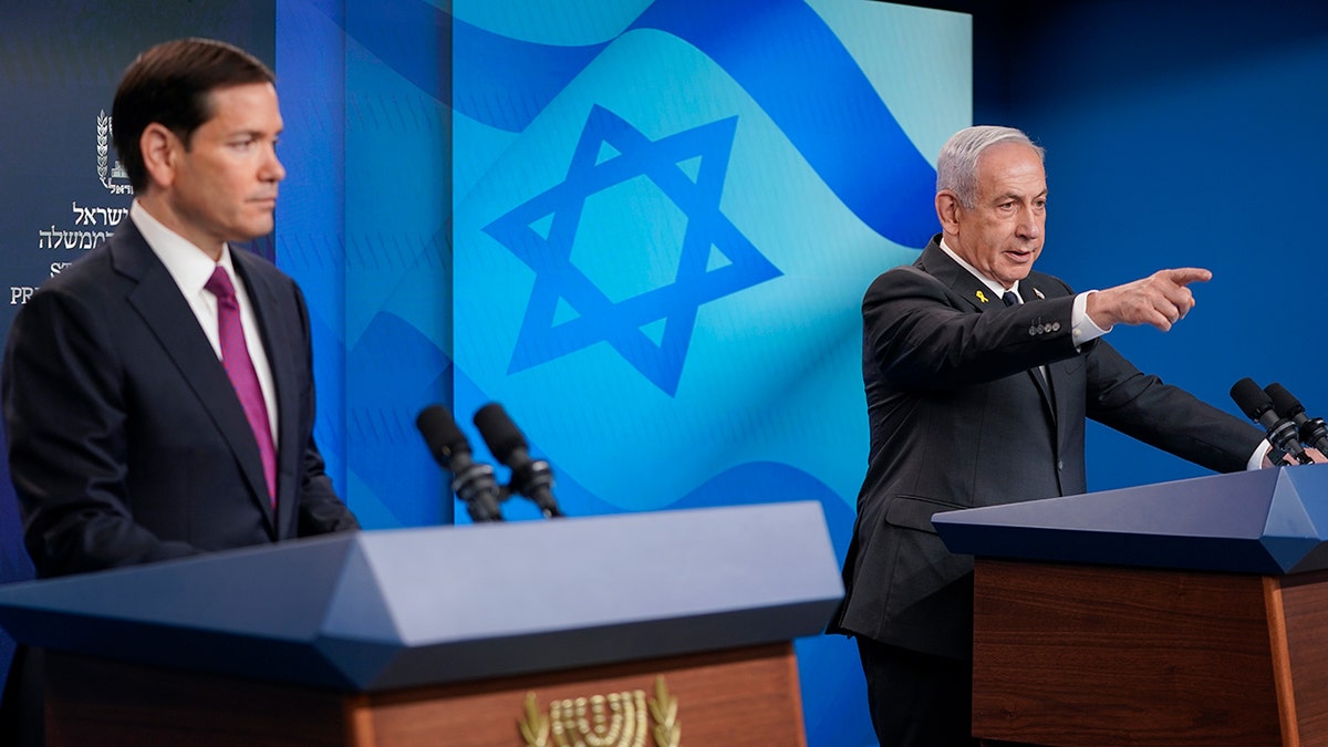 Secretary of State Marco Rubio looking as Prime Minister Benjamin Netanyahu points at a reporter